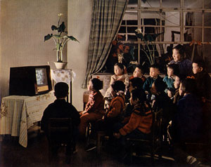 Photograph of children watching TV