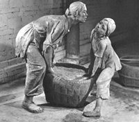 Photo of sculptures - mother and daughter lift basket